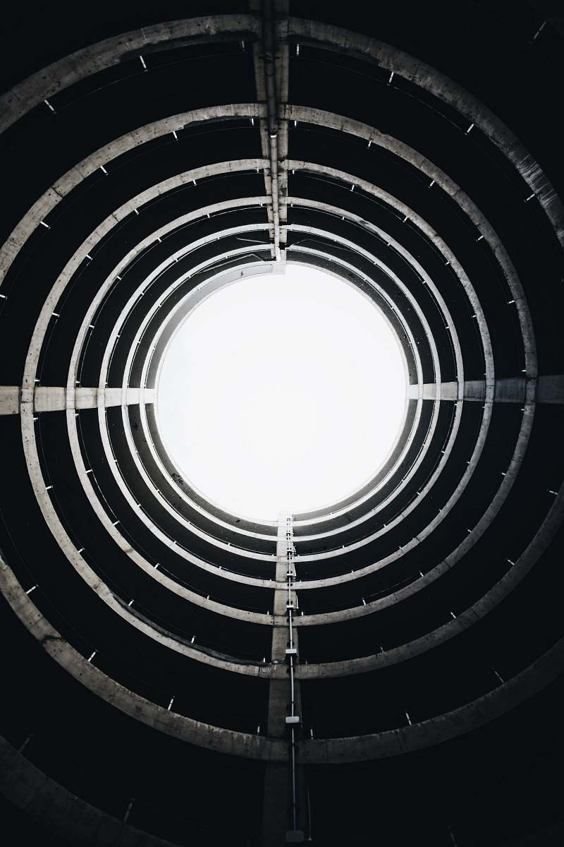 black wallpapers low angle photography of round gray concrete building interior circle